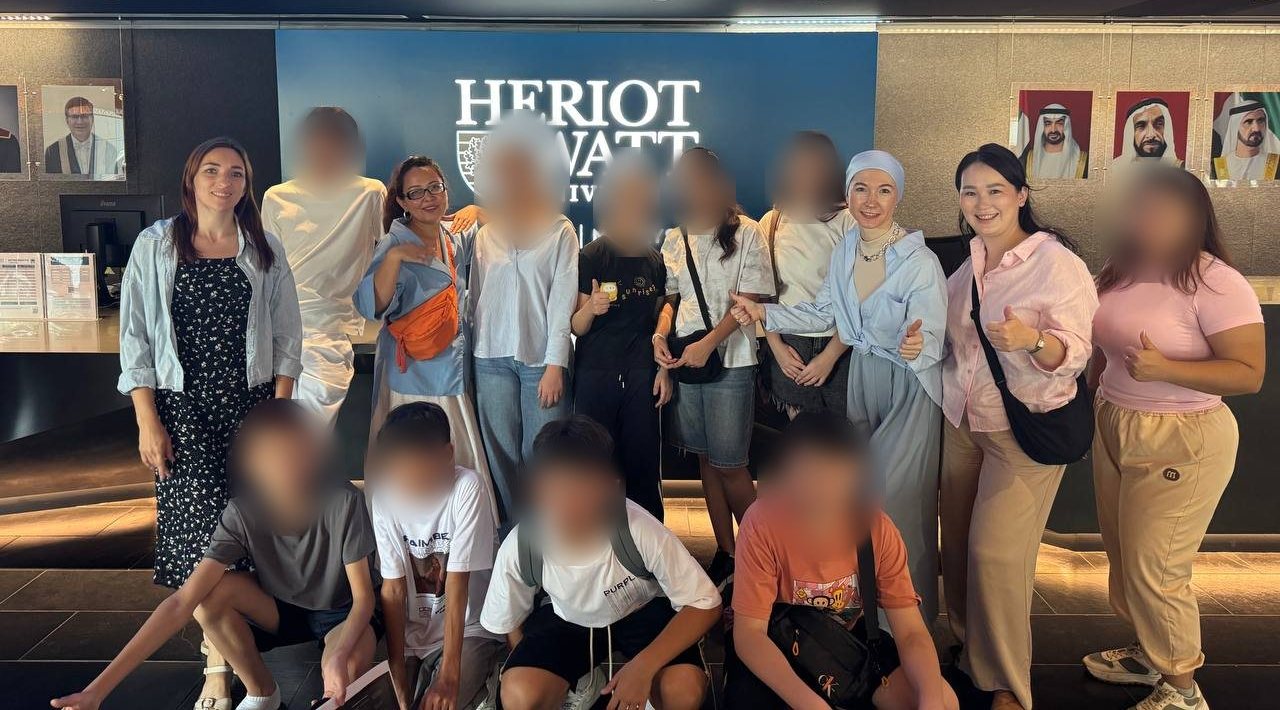 Participants and organisers of the NovaCompass Olympiad at Heriot-Watt University Dubai, with the children's faces blurred